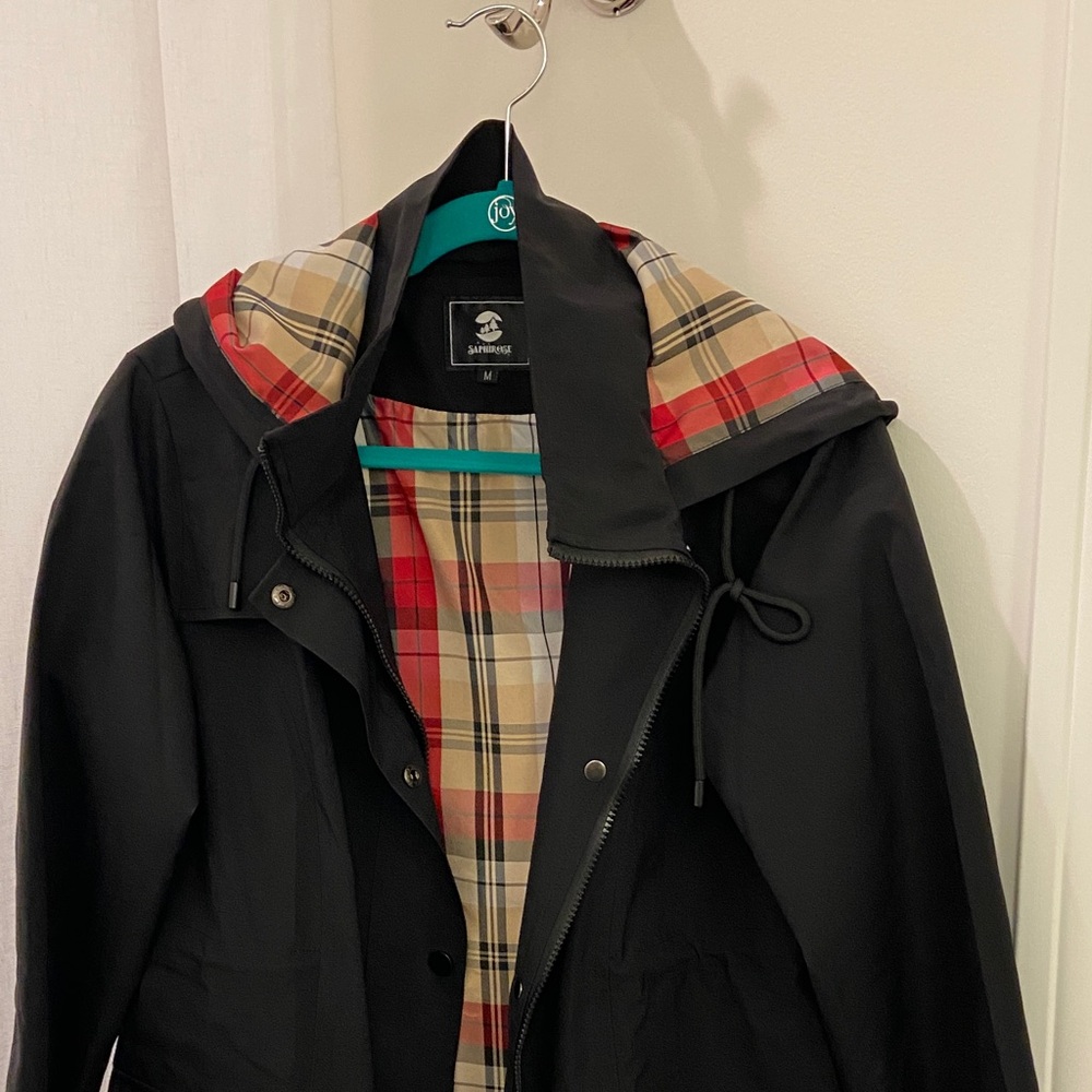 Never worn rain jacket with plaid lining